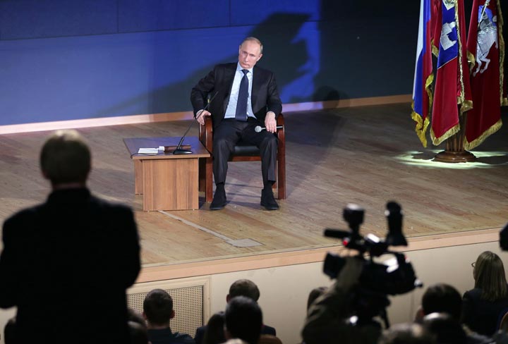 Russian President Vladimir Putin listens to a question from the assembled audience during his meeting with students in the Moscow State University in Moscow, Tuesday, Dec. 3, 2013. Putin says that Russia should beef up its presence in the Arctic for both economic and military reasons.  