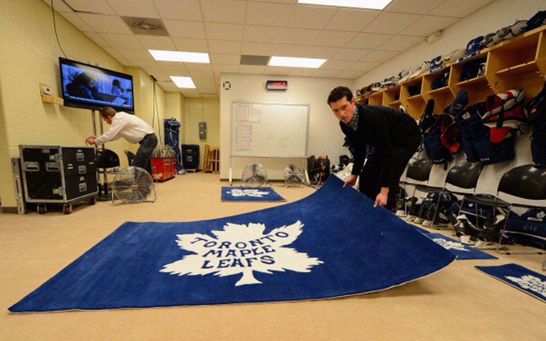 ANN ARBOR, MI - Leafs assistant equipment manager Bobby Hastings prepares the locker room at The Big House for the 2014 Bridgestone NHL Winter Classic.