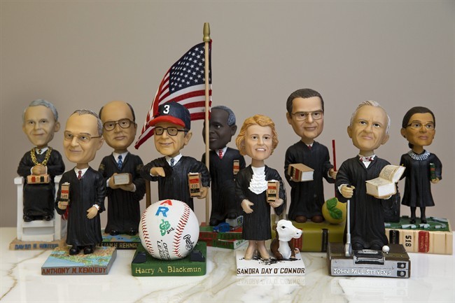 This photo taken Nov. 20, 2013 shows bobblehead dolls representing Supreme Court Justices, in Washington. 
