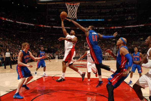 Kyle Lowry #7 of the Toronto Raptors shoots against the Detroit Pistons on January 8, 2014 at the Air Canada Centre in Toronto, Ontario, .