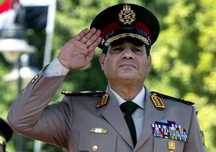 FILE - In this Wednesday, April 24, 2013 file photo, Egyptian Defense Minister Gen. Abdel-Fattah el-Sissi salutes during an arrival ceremony for U.S. Secretary of Defense Chuck Hagel at the Ministry of Defense in Cairo. 