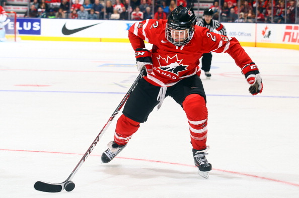 Meghan Agosta-Marciano #2 of Team Canada moves the puck against Team USA during a Sochi preparation game at the Air Canada Centre December 30, 2013 in Toronto.