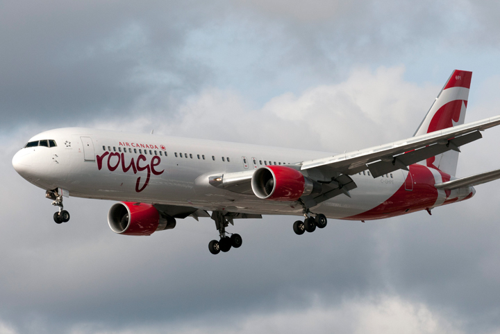 A Boeing 767 (767-300) jetliner, belonging to Air Canada Rouge, lands at Toronto's Pearson International Airport in Ontario on October 24, 2013. 