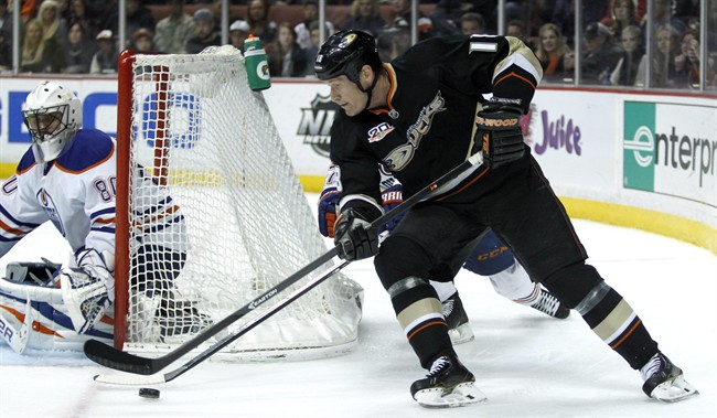 Anaheim Ducks right wing Tim Jackman (18) drives the puck for a shot against Edmonton Oilers goalie Ilya Bryzgalov (80), of Russia during the second period of an NHL hockey game Friday, Jan. 3, 2014, in Los Angeles. 