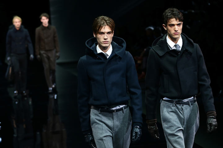 Models walk the runway during the Giorgio Armani show as a part of Milan Fashion Week Menswear Autumn/Winter 2014 on January 14, 2014 in Milan, Italy. (Photo by Vittorio Zunino Celotto/Getty Images)