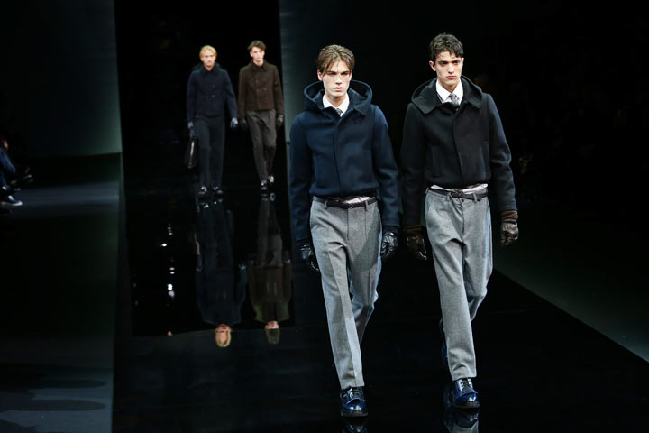 Models walk the runway during the Giorgio Armani show as a part of Milan Fashion Week Menswear Autumn/Winter 2014 on January 14, 2014 in Milan, Italy. (Photo by Vittorio Zunino Celotto/Getty Images)