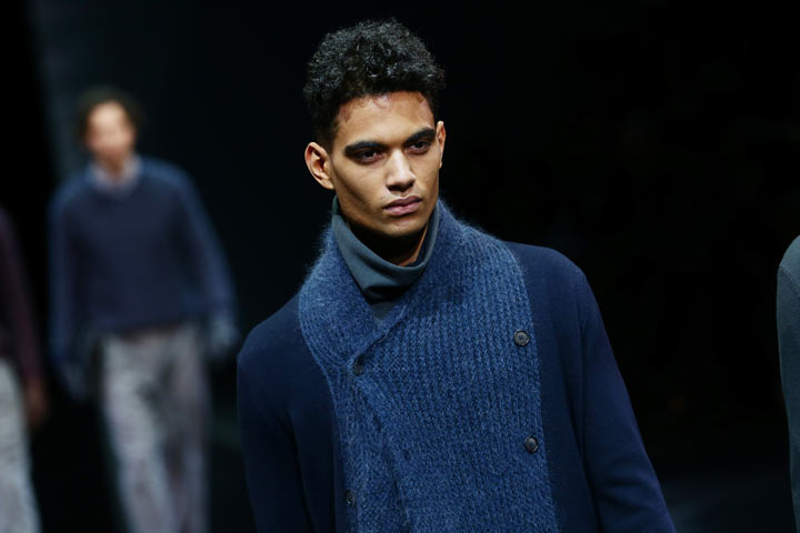 A model walks the runway during the Giorgio Armani show as a part of Milan Fashion Week Menswear Autumn/Winter 2014 on January 14, 2014 in Milan, Italy.