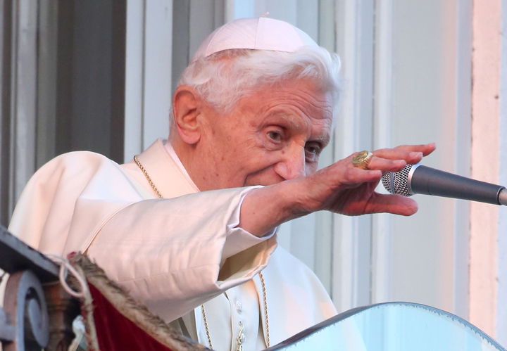 In this file photo, Pope Benedict XVI delivers his blessing to pilgrims, for the last time as head of the Catholic Church, from the window of Castel Gandolfo where he will start his retirement  on February 28, 2013 in Rome, Italy.