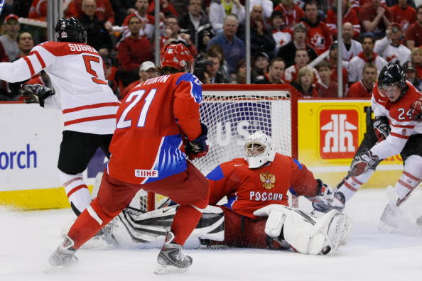 Vadim Zhelobnyuk #1 of Team Russia blocks the puck on an attempt by PK Subban #5 of Team Canada as Jamie Benn #24 crashes the net during the semifinals at the IIHF World Junior Championships at the Ottawa Civic Centre on January 03, 2009 in Ottawa.