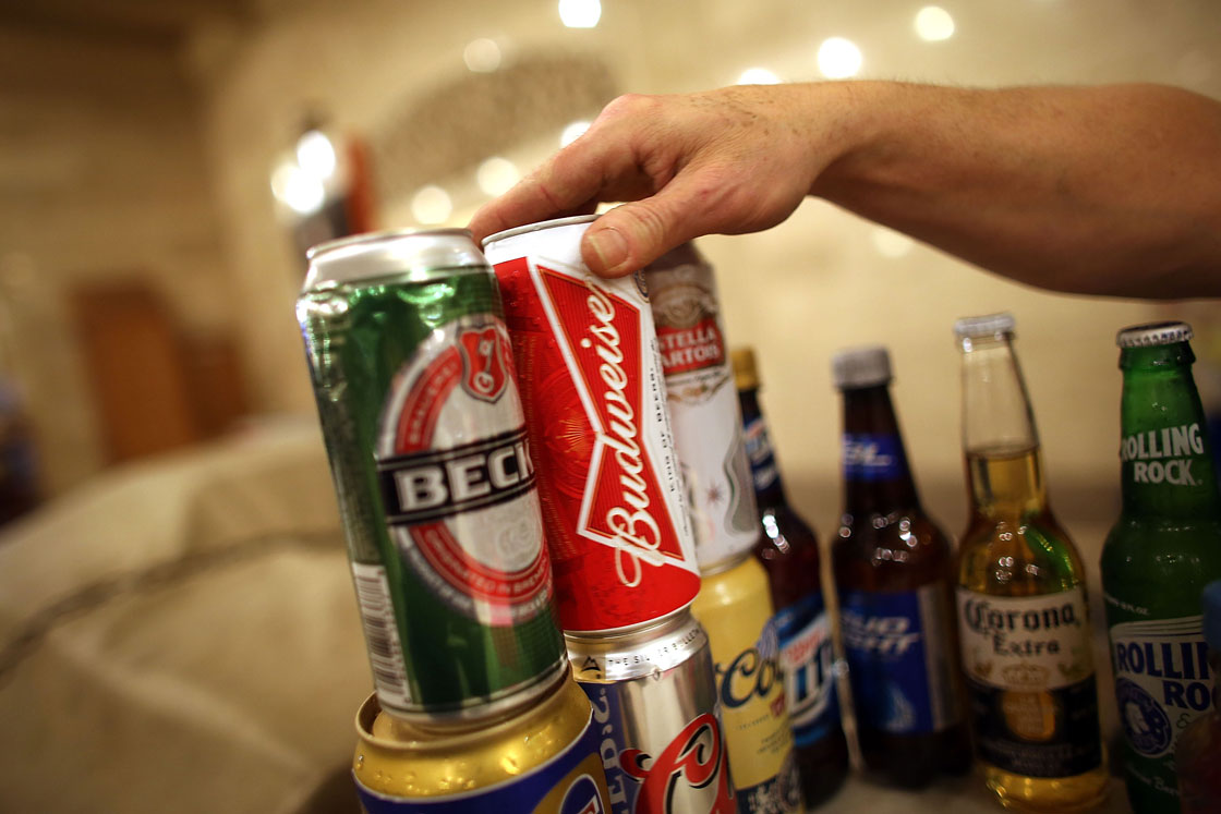 InBev is buying back Asian breweries it was forced to sell during the financial crisis.