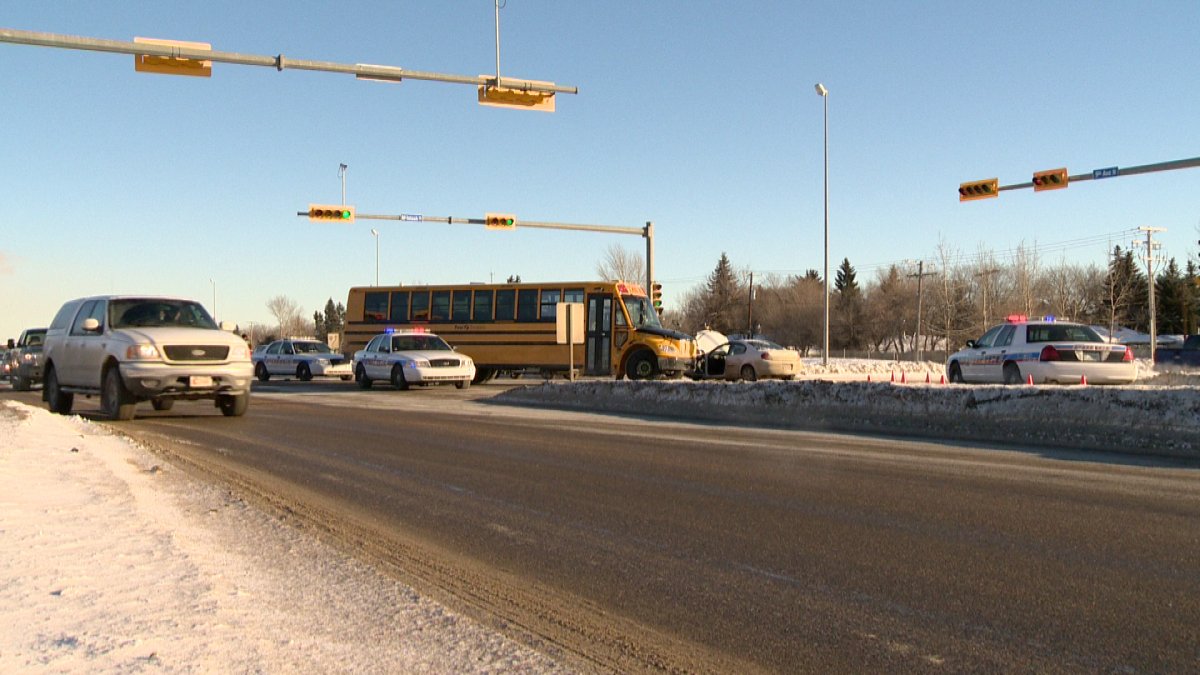 Two people have been sent to hospital with minor injuries after a car and a school bus collided Wednesday afternoon in northwest Regina.
