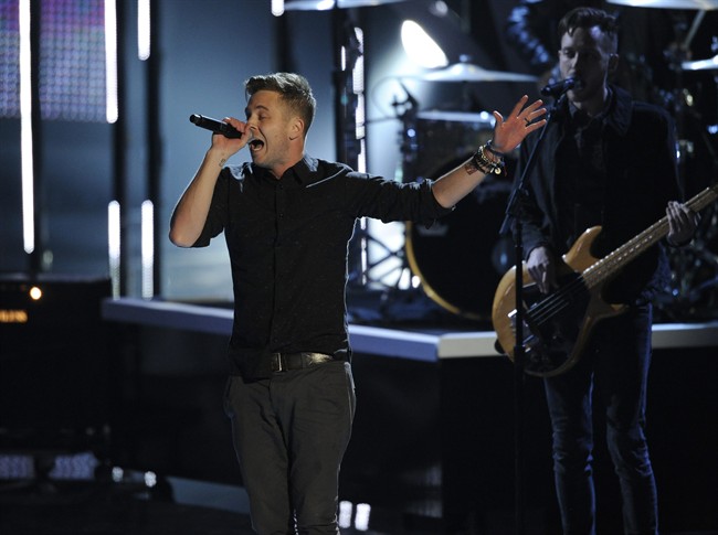 Ryan Tedder, of the musical group OneRepublic, performs "Counting Stars" on stage at the 40th annual People's Choice Awards at the Nokia Theatre L.A. Live on Wednesday, Jan. 8, 2014, in Los Angeles. (Photo by Chris Pizzello/Invision/AP).