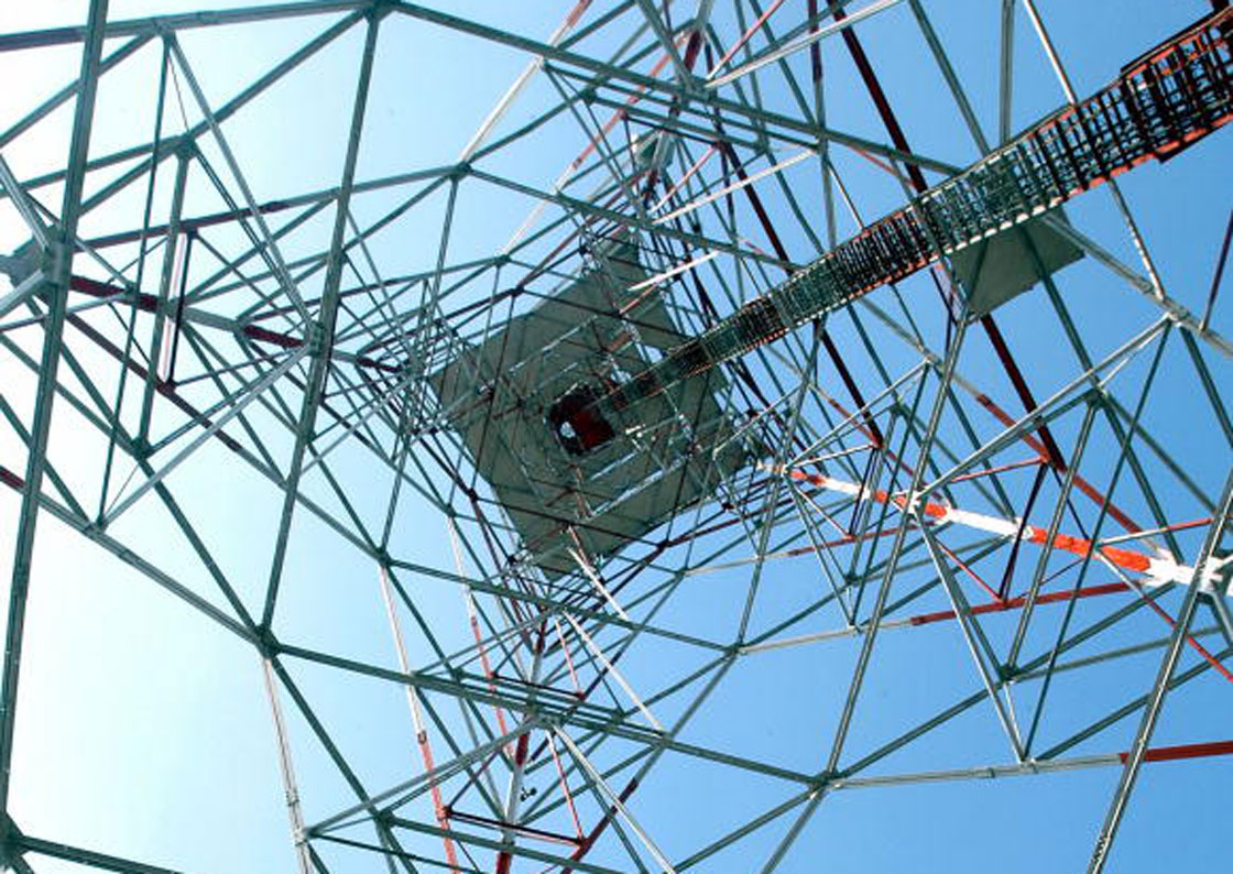 A cellphone tower used to house network equipment that transfers wireless data to and from connected devices. 