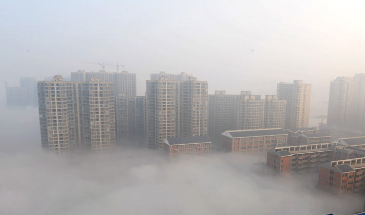 Buildings are shrouded in smog on January 14, 2014 in Changsha, Hunan Province of China. 