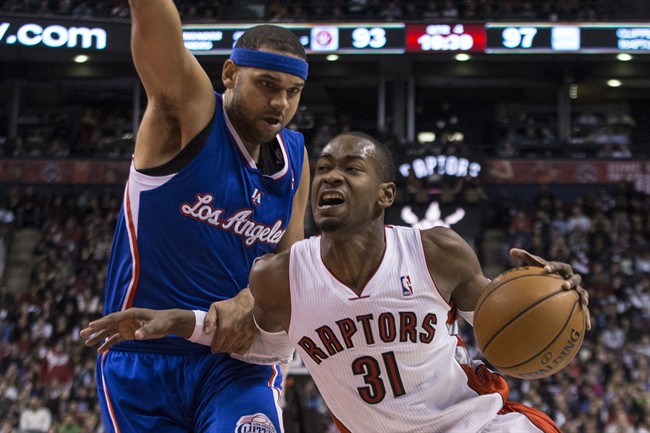 Toronto Raptors’ Terrence Ross (right) drives past Los Angeles Clippers’ Jared Dudley during second half NBA basketball action in Toronto on Saturday January 25 , 2014.