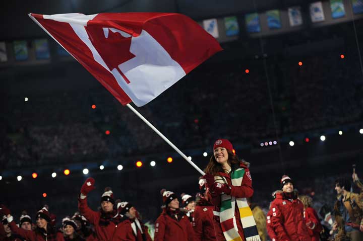 Clara Hughes carries the flag at Vancouver Olympics