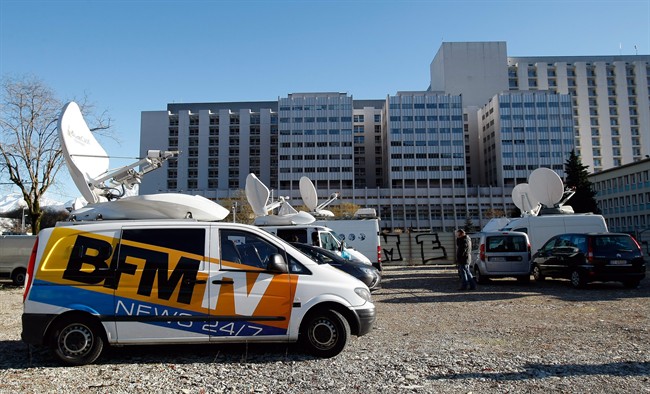A TV van is parked in front of the Grenoble hospital, French Alps, Sunday, Jan. 5 , 2014, where former seven-time Formula One champion Michael Schumacher is being treated after sustaining a head injury during a ski accident. 