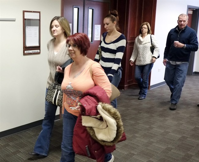 Family and victims arrive for a hearing for Aurora theater shooting suspect James Holmes at district court in Centennial, Colo., on Friday Jan. 31, 2014. 