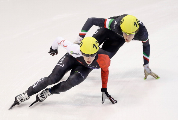  Charle Cournoyer of Canada (L) leads Tommaso Dotti of Italy during the Men's 1000m preliminaries on day two of the Samsung ISU Short Track World Cup at the Palatazzoli on November 8, 2013 in Turin, Italy. 