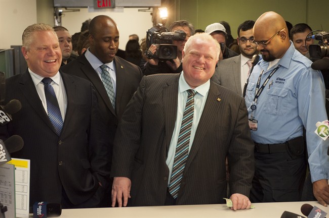 Toronto Mayor Rob Ford registers as a candidate Thursday, Jan. 2, 2014 for the city's 2014 municipal election in October. Councillor Doug Ford is at left. THE CANADIAN PRESS/Victor Biro.
