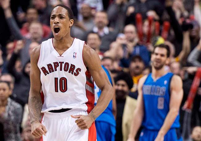 Toronto Raptors forward DeMar DeRozan reacts after making a basket against the Dallas Mavericks during second half NBA basketball action in Toronto on Wednesday, January 22, 2014. 