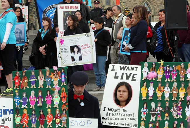 Demonstrators honour the lives of missing and murdered Aboriginal women and girls on Parliament Hill in Ottawa in this Oct. 4, 2013 file photo.