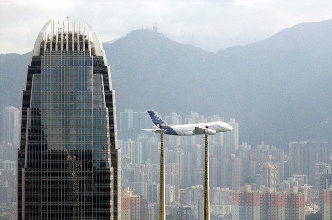 An Airbus A380 flies over Victoria Harbour in Hong Kong Monday Sept 3, 2007. A Toronto grandmother came home from Hong Kong with SARS. 