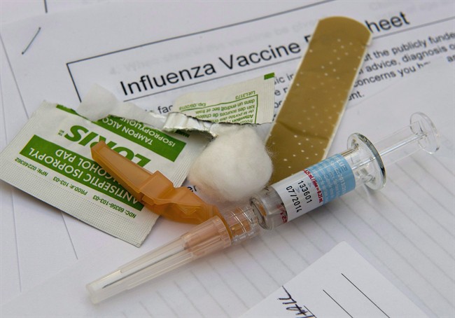 A syringe with the flu vaccine sits ready for use at the annual meeting of the Ontario Hospital Association in Toronto.