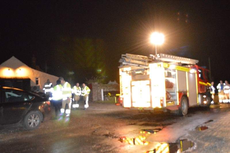 Emergency services at Salthouse, near North Norfolk, after an American military HH-60G Pave Hawk helicopter, crashed with the loss of four lives, during a training mission outside Cley-Next-The-Sea Tuesday Jan. 7, 2014. (AP Photo/Ben Kendall, PA)
