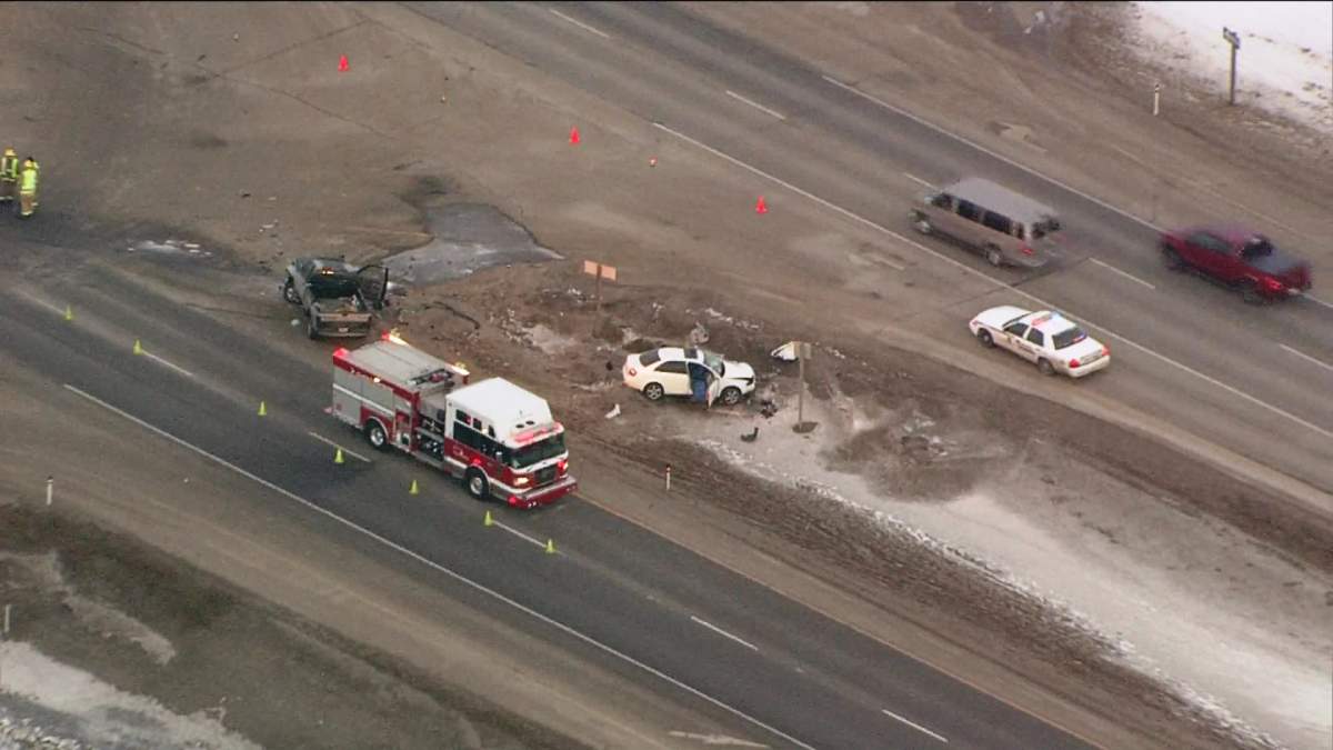 Emergency crews investigate a crash on the Trans-Canada Highway just east of Chestermere on Wednesday, January 29, 2014.