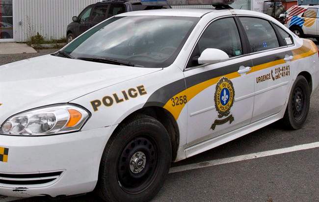 Quebec provincial police investigate a double hit-and-run in Acton Vale on Friday July 11, 2014.