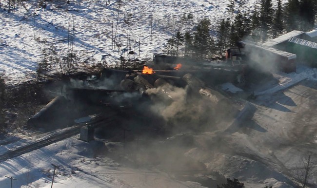 Derailed train cars continue to burn in Plaster Rock, N.B., Jan. 8, 2014. 