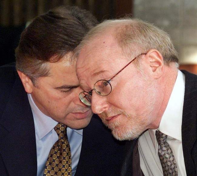 Then Dalhousie University President Tom Traves listens to Brian Tobin in a 2001 photo. 