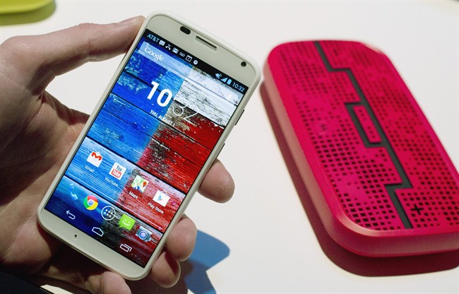 The Motorola Moto X smartphone is displayed, Aug. 1, 2013 at a press preview in New York. 