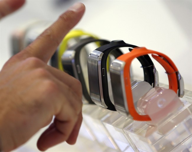 A visitor points at smartwatches in Berlin.
