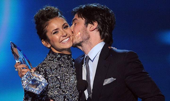 Nina Dobrev gets a kiss from Ian Somerhalder at the People’s Choice Awards on Jan. 8, 2014.