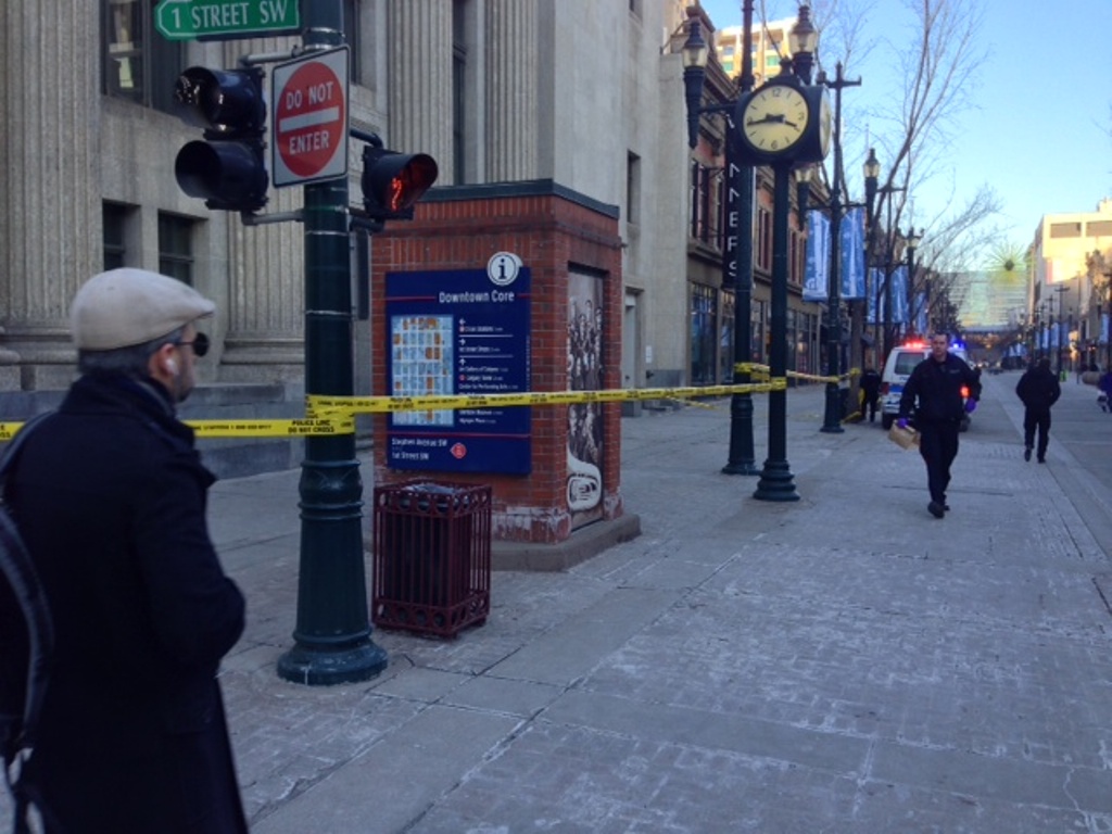 A stabbing scene is taped off in downtown Calgary at  8 Avenue and 1 Street S.W.