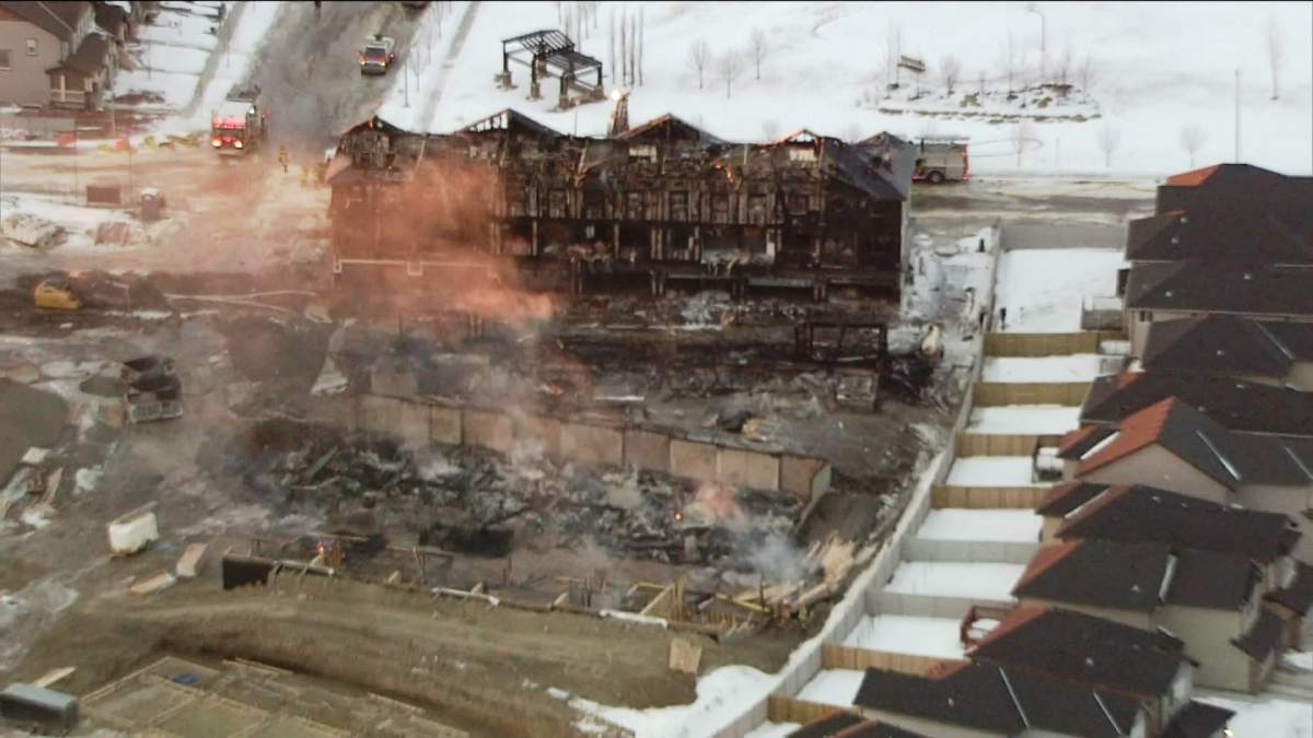 Emergency crews battle a blaze in Panorama Hills that destroyed several condo buildings on Friday, January 10, 2014.