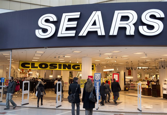 Shoppers make their way through the Sears store at the Eaton Centre in downtown Toronto on Monday, January 13, 2014.