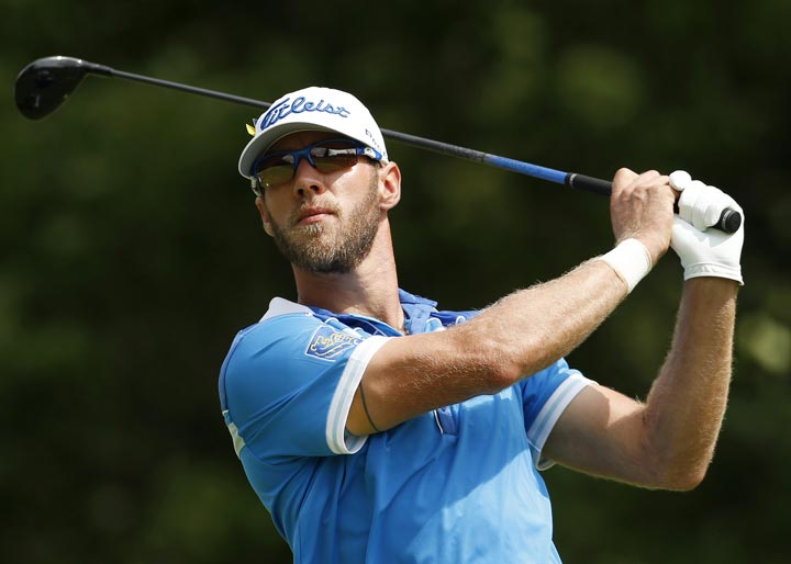Graham DeLaet tees off on the first hole during the final round of the Deutsche Bank Championship golf tournament in Norton, Mass., Monday, Sept. 2, 2013. (AP Photo/Michael Dwyer)