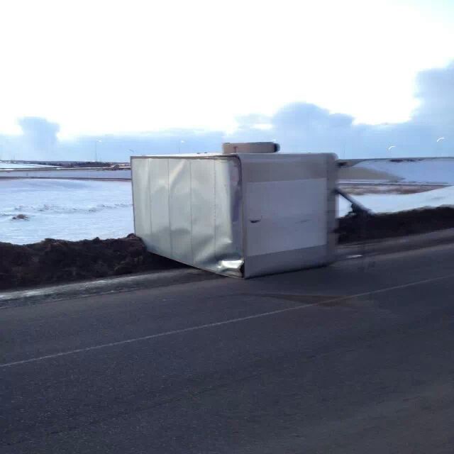A trailer is tipped over on its side on Anthony Henday Drive reportedly by high winds, Wednesday, January 15, 2014.