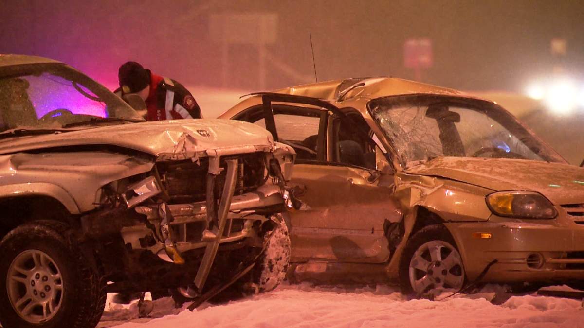 Police investigate a hit and run collision at Anderson Road and 14 Street S.W. on January 29, 2014. A Hyundai was rear-ended by another vehicle, which pushed it into oncoming traffic. It was then t-boned by a westbound Dodge Durango as it passed through the intersection.
