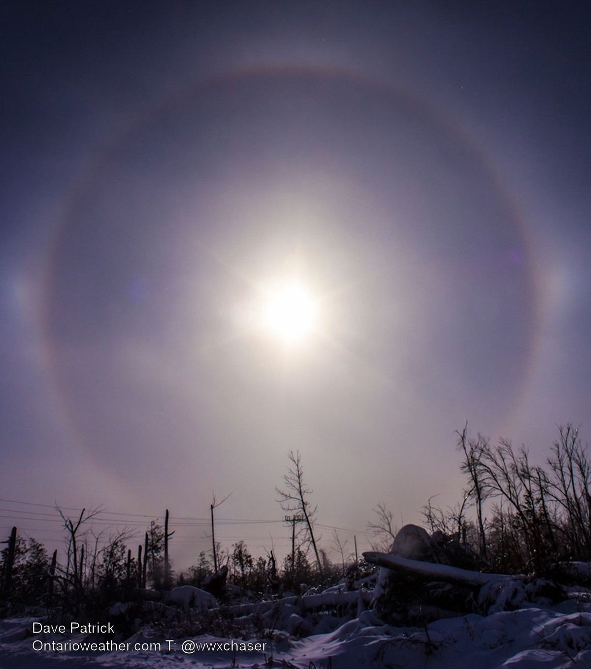 A sun halo with sundogs (to the left and right) rise over Fergus, Ont.