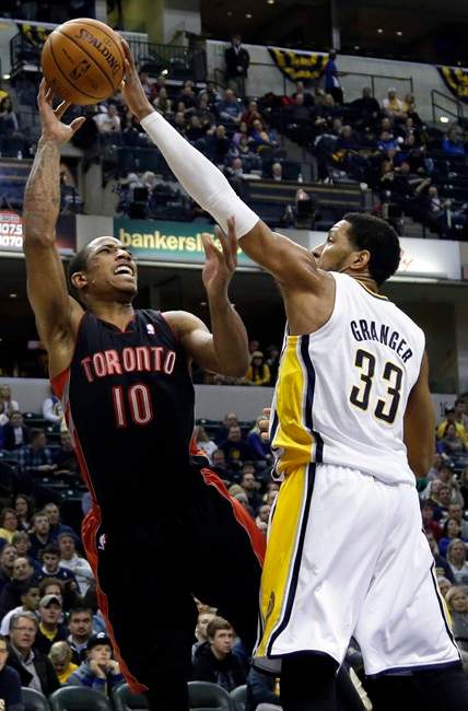 Toronto Raptors guard DeMar DeRozan (10) gets his shot blocked by Indiana Pacers forward Danny Granger during the first half of an NBA basketball game in Indianapolis, Tuesday, Jan. 7, 2014. Granger was called for a foul on the play.