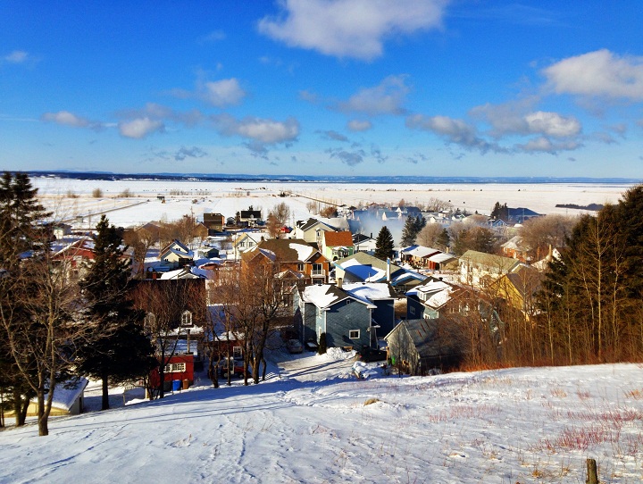 A view of the small Quebec town of L’Isle-Verte, with the still-smoking ruins of the seniors home on January 23, 2014.