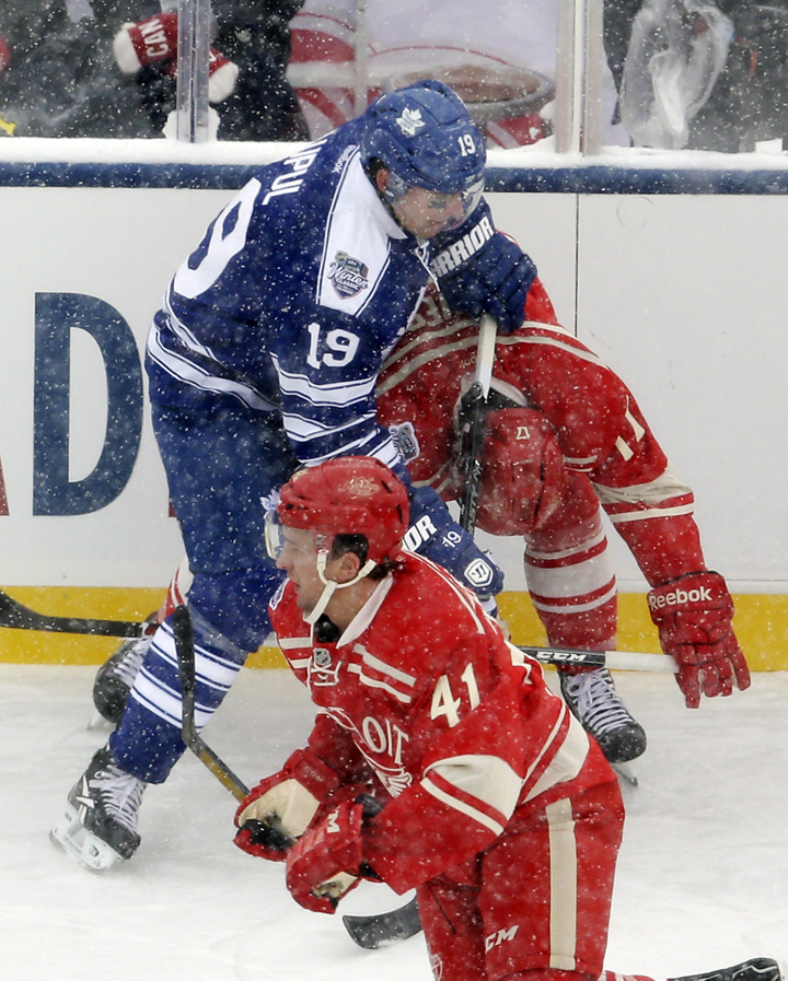 Toronto Maple Leafs right wing Joffrey Lupul (19) cross checks Detroit Red Wings forward Patrick Eaves during the first period of the Winter Classic