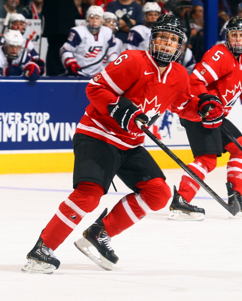 Rebecca Johnston #6 of Team Canada skates up the ice of Team USA during a Sochi preparation game at the Air Canada Centre December 30, 2013 in Toronto.