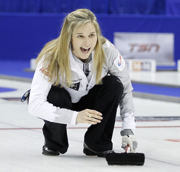Skip Jennifer Jones shouts instructions to her sweepers during the Women's Final against Team Middaugh at the Roar of the Rings Canadian Olympic Curling Trials on December 7, 2013 at MTS Centre in Winnipeg, Manitoba.