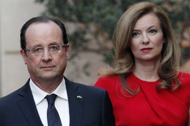 FILE - In this Tuesday, May. 7, 2013, file photo, French President Francois Hollande, left, and his companion Valerie Trierweiler arrive for a state dinner at the Elysee Palace, in Paris as part of Polish President Bronislaw Komorowski's two-day visit to France. The woman considered France's first lady has been hospitalized after a report that the president is having an affair with an actress.