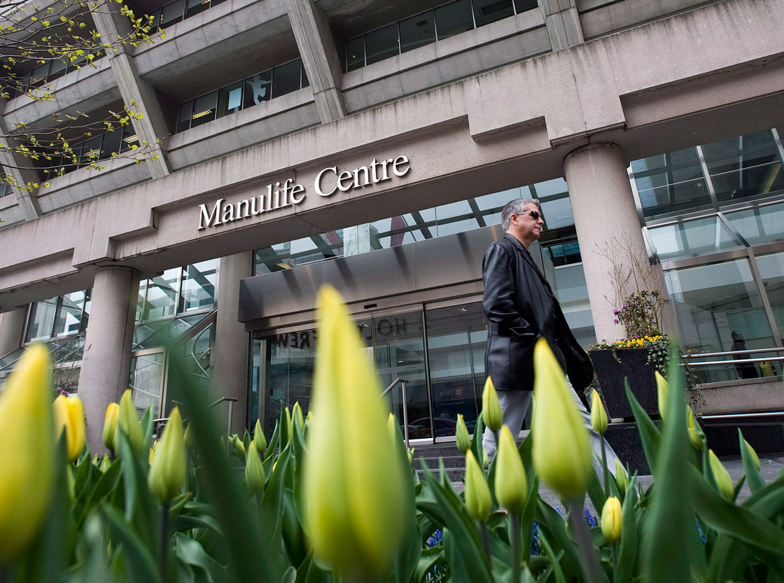 Manulife Financial says many Canadians plan to dial back on free-spending lifestyles this year to address yawning debt loads.